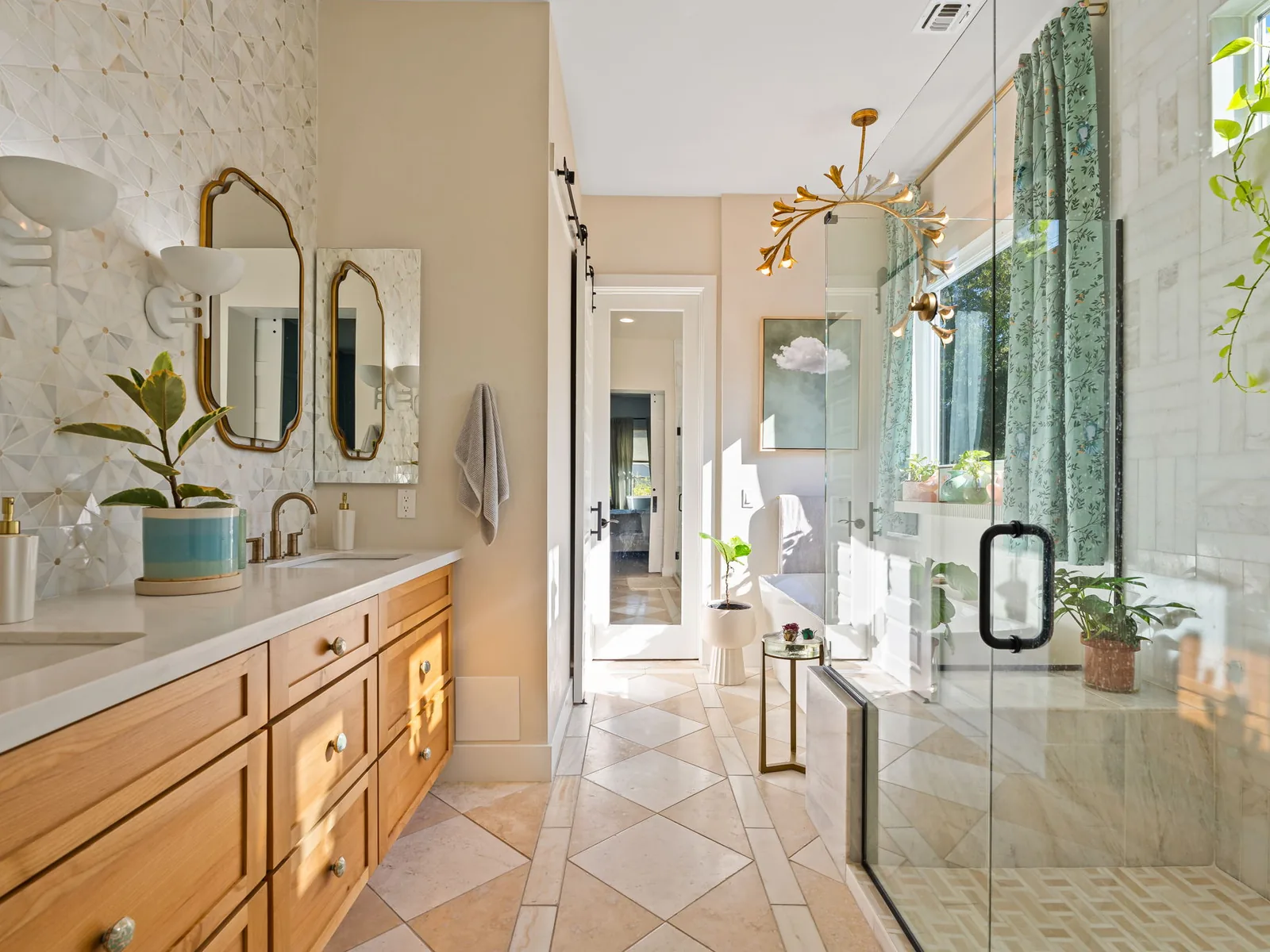 Bathroom remodeling with a wood double vanity, a mosaic tile wall, a glass shower and diagonal stone tile floor