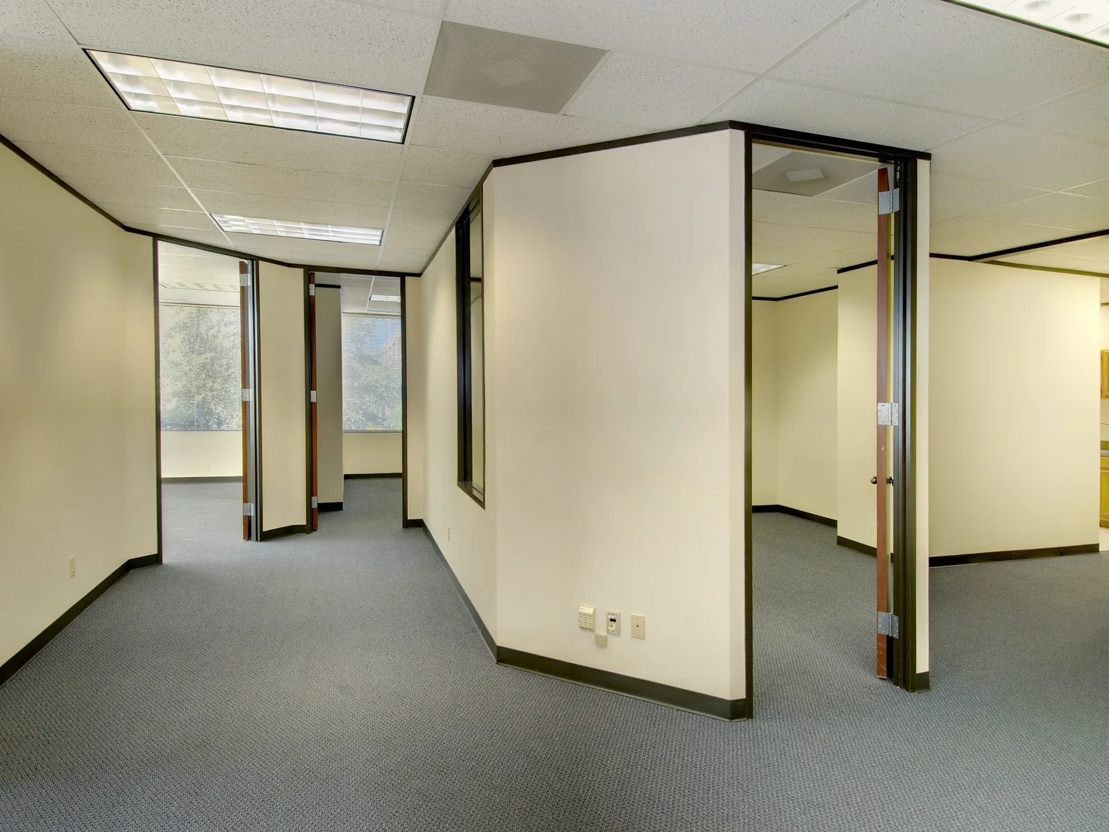 Commercial remodeling: a finished small office suite build out with new walls and doors, a drop ceiling and carpet